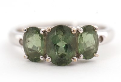 Lot 127 - A 9ct apatite and diamond ring, with three...