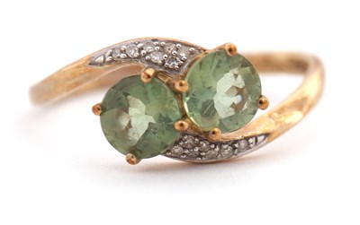 Lot 131 - A 9ct apatite and diamond ring, with two round...