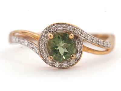 Lot 128 - A 9ct apatite and diamond ring,the round...