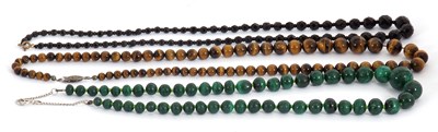 Lot 259 - A malachite bead necklace with extender and...