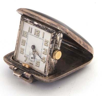 Lot 191 - A silver and enamel travel clock, the clock...
