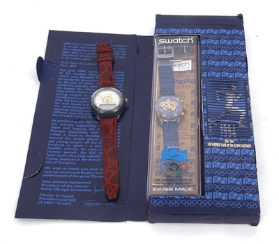Lot 245 - Two gents Swatch watches, one commemorative of...