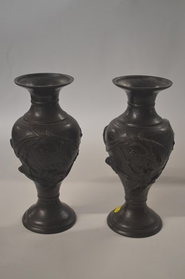 Lot 211 - A pair of Japanese bronze vases with relief...