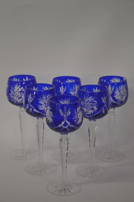 Lot 245 - A group of six blue glass Hock glasses on...
