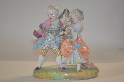 Lot 325 - A late 19th Century porcelain group of boy and...