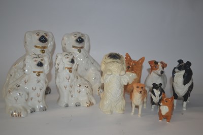 Lot 328 - Group of Beswick dogs including two sets of...