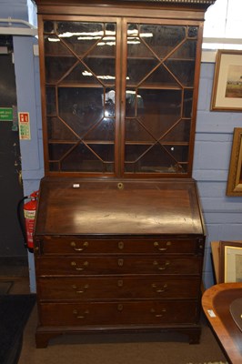 Lot 553 - A Georgian mahogany bureau bookcase, the top...