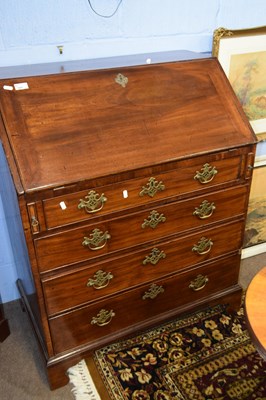 Lot 555 - A Georgian mahogany bureau of small...