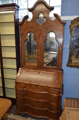 Lot 379 - A reproduction walnut Italian bureau bookcase...