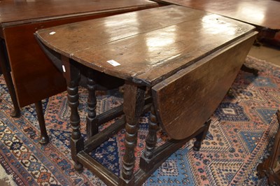 Lot 438 - An early 18th Century oak drop leaf dining...