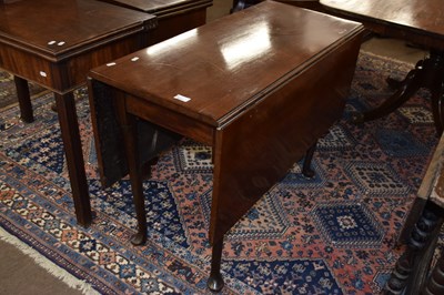 Lot 554 - A George III mahogany drop leaf dining table...