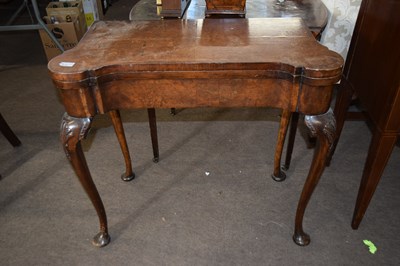 Lot 612 - A Georgian Revival burr walnut veneered card...
