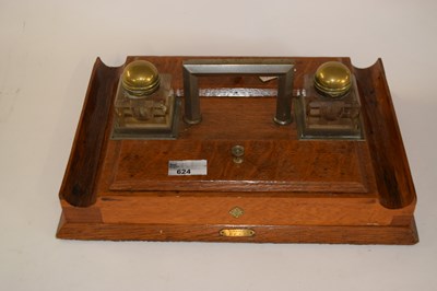 Lot 624 - An oak desk stand fitted with two brass...