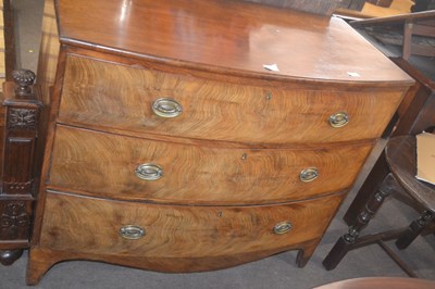 Lot 373 - A Georgian mahogany bow front chest of three...