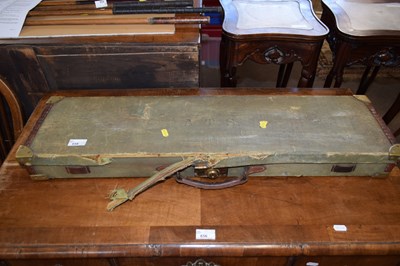Lot 262 - A canvas covered gun case the label to...