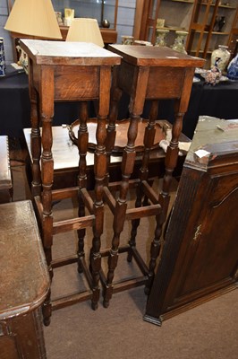 Lot 661 - A pair of 20th Century oak jardiniere stands