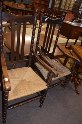 Lot 664 - A pair of 20th Century rush seated oak framed...