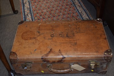 Lot 673 - A large vintage brown leather suitcase, the...