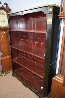 Lot 377 - A 20th Century ebonised open front bookcase...