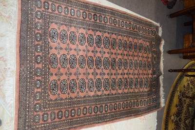 Lot 469 - A 20th Century Pakistani machine made rug with...