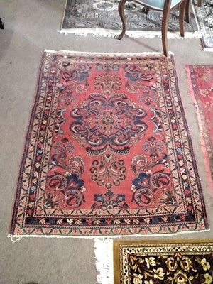Lot 712 - A small Middle Eastern red ground rug...
