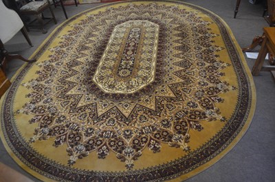 Lot 718 - A 20th Century oval machine made wool floor...