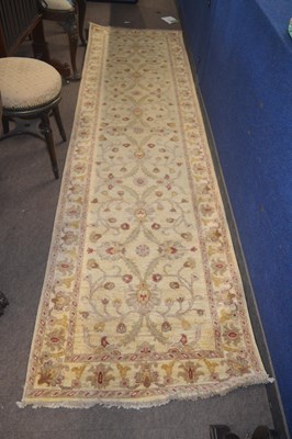 Lot 468 - A 20th Century pale ground runner carpet...