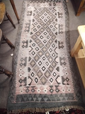 Lot 487 - An antique Kilim carpet decorated with a...