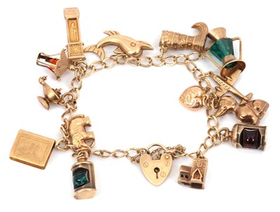 Lot 208 - A 9ct charm bracelet, the curblink bracelet...