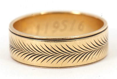 Lot 227 - An 18ct ring, with all around engraved...