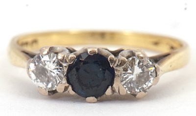 Lot 55 - An 18ct sapphire and diamond ring, set with...