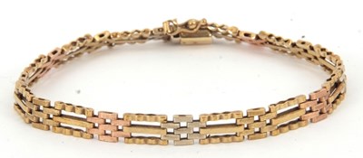 Lot 192 - A 9ct gate bracelet, in tri-colour gold, with...