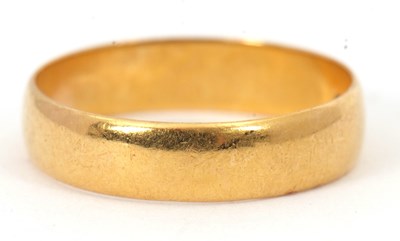 Lot 229 - A 22ct wedding band, 4.5mm wide, hallmarked...