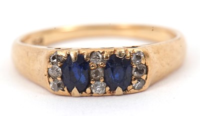 Lot 108 - An 18ct sapphire and diamond ring, set with...