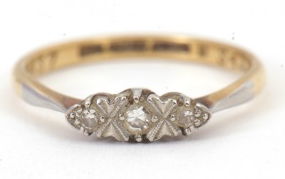 Lot 56 - A diamond ring, set with three small single...