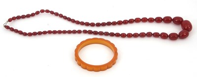 Lot 263 - A bakelite 'cherry amber' bead necklace and a...