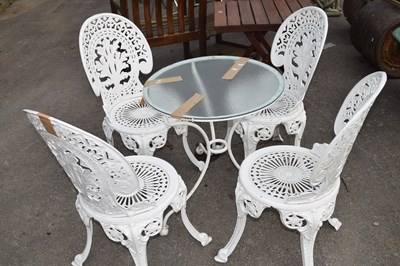 Lot 40 - Set of four matching cast chairs with a small...