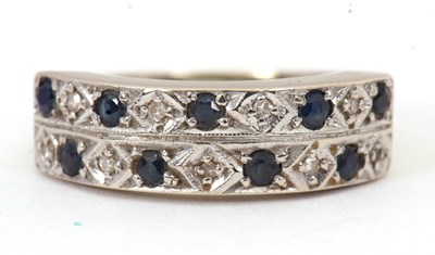 Lot 47 - A sapphire and diamond ring, the 6mm deep band...