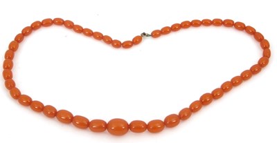 Lot 264 - An amber bead necklace, with oval graduated...