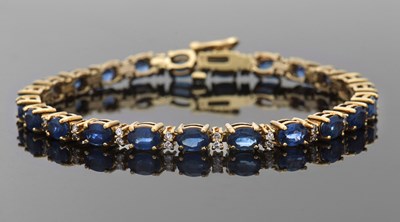 Lot 401 - A 9ct sapphire and diamond bracelet, set...