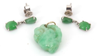 Lot 255 - A pair of jade earrings and a pendant: the...