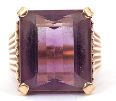 Lot 121 - An amethyst ring, the the modified step cut...