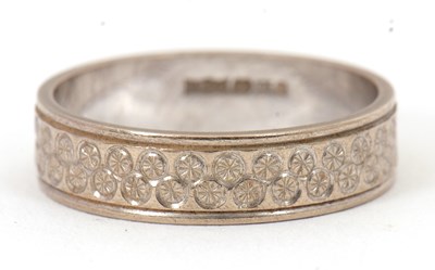 Lot 231 - A 9ct wedding band, with engraved decoration,...