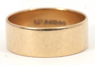 Lot 228 - A 9ct wedding band, 7.5mm wide, hallmarked...