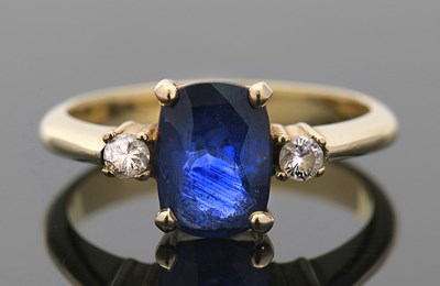 Lot 400 - A sapphire and diamond ring, the oval mixed...
