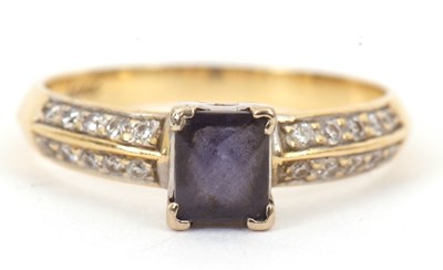 Lot 117 - An 18ct iolite and diamond ring, with central...