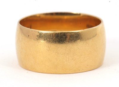 Lot 225 - An 18ct wedding band, 9mm deep, hallmarked...