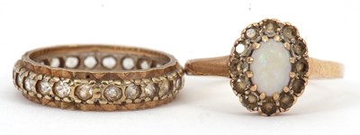 Lot 143 - Two gemset rings: to include an opal and white...