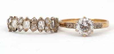 Lot 144 - Two 9ct CZ rings: to include one set with...