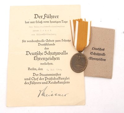 Lot 65 - WWII: German West Wall Medal with Ribbon and Packet